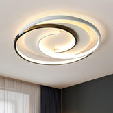 Modern ceiling light fixture on a ceiling with a neutral background